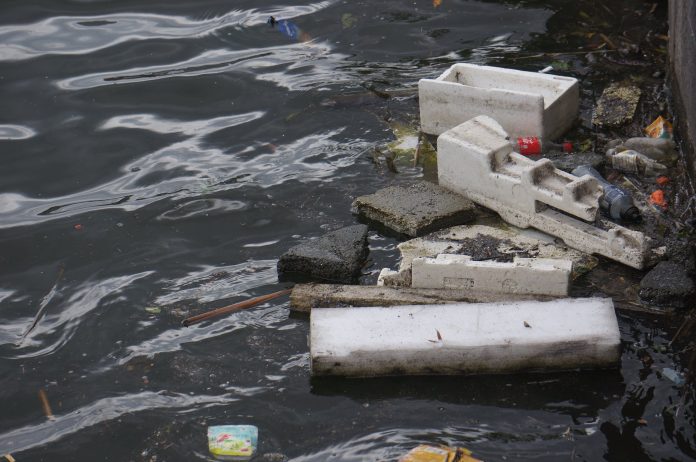 pexels-photo-12308283 waste on river water